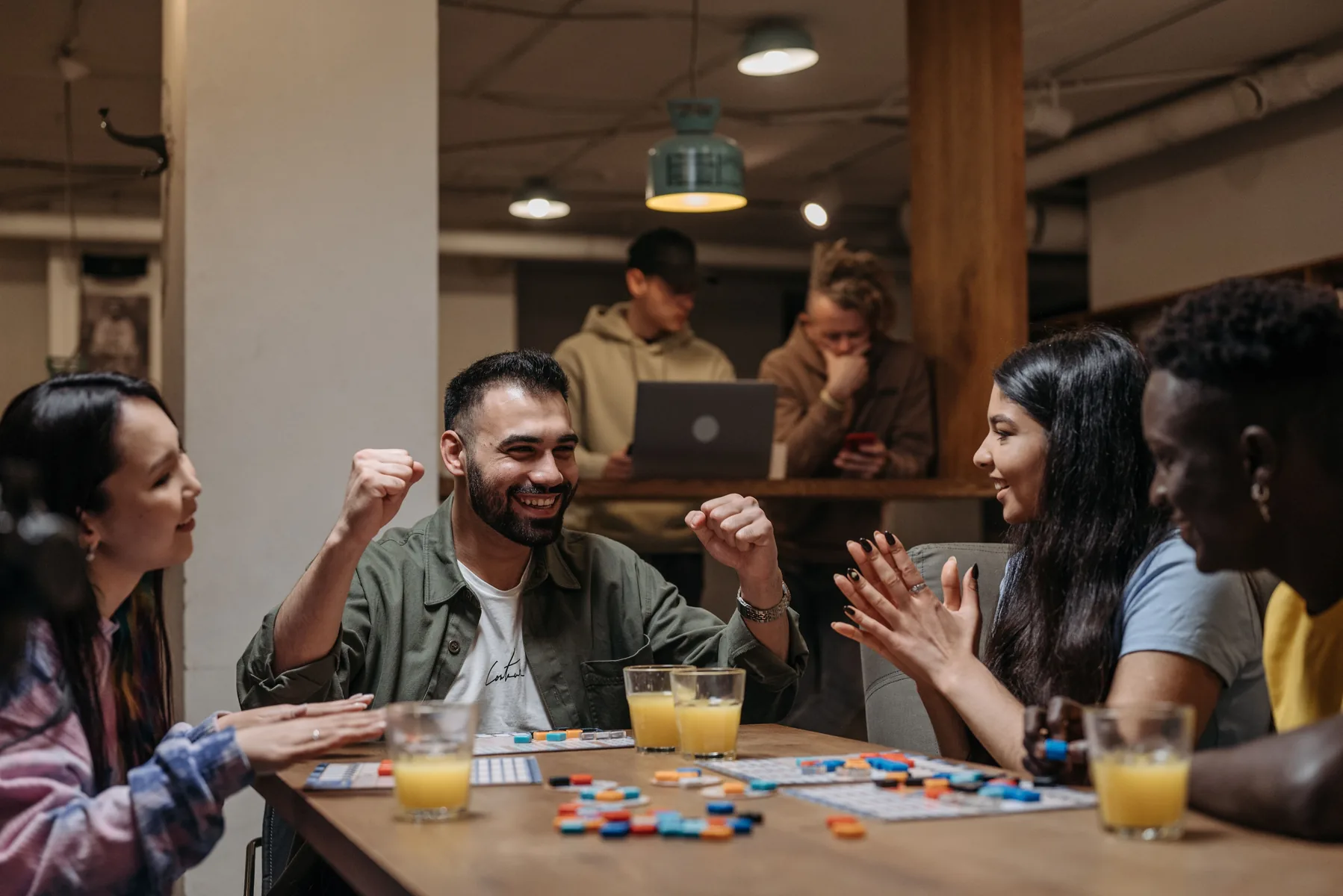 Friends gathered around a tabletop game